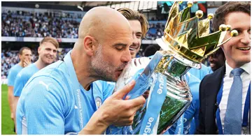 Pep Guardiola kisses the Premier League trophy after the EPL match between Manchester City and Aston Villa at Etihad Stadium. Photo by Matt McNulty.