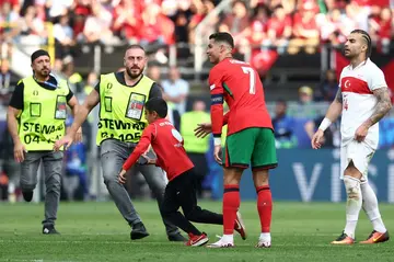 A young fan managed to get a selfie with Cristiano Ronaldo before trying to evade stadium security