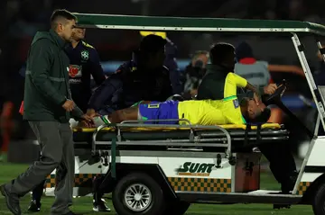 Brazilian star forward Neymar is taken off the field after suffering a knee injury on October 17, 2023