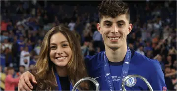 Kai Havertz of Chelsea celebrates with Sophia Weber and the Champions League trophy following their team's victory in the UEFA Champions League final. Photo by Alexander Hassenstein.