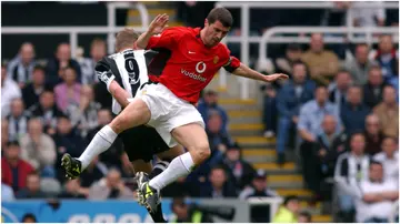 Roy Keane in action with Alan Shearer during a Premier League match. Photo by Neal Simpson.