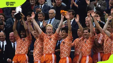 Best Dutch soccer players ever include Dutch legend Ruud Gullit (L) who lifted the European Championship trophy following their victory over the USSR at the Olympia Stadium on 25 June 1988 in Munich, Germany.
