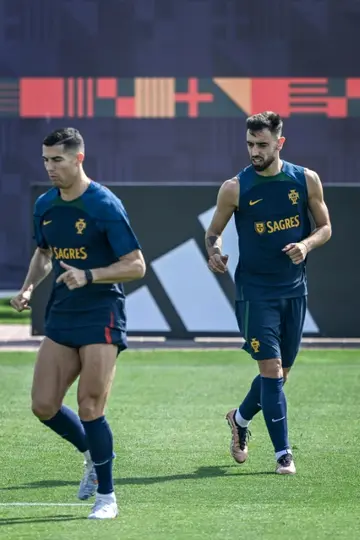 Fernandes with his Manchester United teammate Cristiano Ronaldo preparing for Portugal's opening World Cup game against Ghana