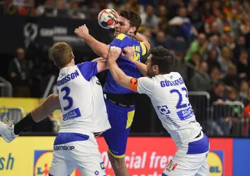 How many players are in each handball team?