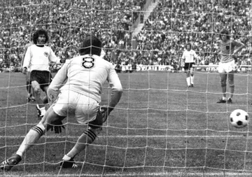 West Germany's Paul Breitner blasts a peanlty past Dutch goalkeeper Jan Jongbloed in the 1974 World Cup final