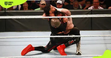 Jey Uso (l) wrestles during WWE Backlash.