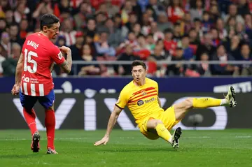 Barcelona forward Robert Lewandowski scores his team's second goal in their win at Atletico Madrid on Sunday in La Liga