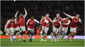 Arsenal stars celebrate after winning the penalty shoot-out during the UEFA Champions League match against FC Porto at Emirates Stadium. Photo by David Price.