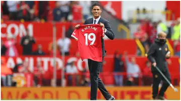 Raphael Varane is introduced to fans on the pitch prior to the Premier League match between Manchester United and Leeds United at Old Trafford. Photo by Catherine Ivill.