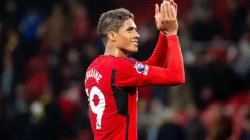 Raphael Varane applauds the fans after the Premier League match between Manchester United and Wolves at Old Trafford. Photo by Ash Donelon.