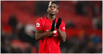 Manchester United's Paul Pogba applauds the fans after the Premier League match at Old Trafford, Manchester. Photo by Martin Rickett.