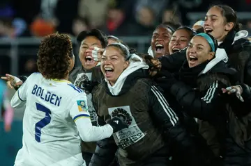 Sarina Bolden (L) celebrates scoring her team's winner