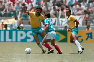 Socrates sidesteps Alain Giresse of France in a World Cup quarterfinal in Mexico in 1986