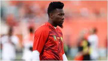 Andre Onana warms up ahead of the Africa Cup of Nations (CAN) 2024 group C football match between Gambia and Cameroon at Stade de la Paix. Photo by KENZO TRIBOUILLARD.