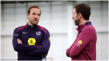 Harry Kane talks to Gareth Southgate during a training session at St George's Park. Photo by Eddie Keogh.