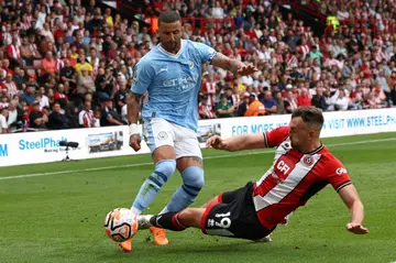 Kyle Walker (left) has extended his contract at Manchester City till 2026