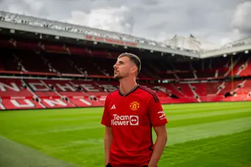 Mason Mount poses after signing for the club at Carrington Training Ground in Manchester. Photo by Manchester United.