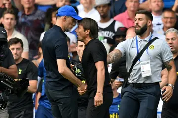 Tottenham's Antonio Conte (R) and Chelsea's Thomas Tuchel clash on the touchline