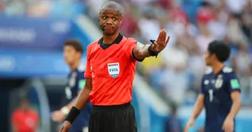 Referee Janny Sikazwe gestures during the 2018 FIFA World Cup Russia group H match between Japan and Poland at Volgograd Arena on June 28, 2018 in Volgograd, Russia. (Photo by Matthew Ashton - AMA/Getty Images)