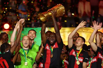 Victor Boniface lifted the DFB-Pokal Trophy after Bayer 04 Leverkusen's victory over 1. FC Kaiserslautern in final at Olympiastadion on May 25, 2024. Photo: Lars Baron.