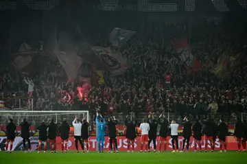 Union Berlin's players celebrate after defeating Ajax to qualify for the last 16 in the Europa League on Thursday