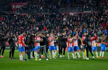 Girona coach Michel and the players celebrate after their thrilling 4-3 win over Atletico Madrid earlier in January