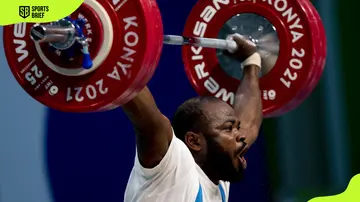 Olawale Barde Patrick of Nigeria competes in men's weightlifting