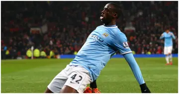 Yaya Toure celebrates scoring the third goal during the Barclays Premier League match between Man United and Man City at Old Trafford on March 25, 2014. Photo by Alex Livesey.