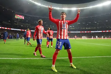 Atletico Madrid's Spanish midfielder Rodrigo Riquelme celebrates scoring is team's fourth goal against Real Madrid