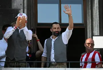 Outgoing Bayern Munich's Bosnian sporting director Hasan Salihamidzic waves to the crowd at his side's title celebration