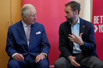 England football manager Gareth Southgate speaks with Britain's King Charles III