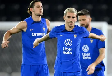 Griezmann in front of Adrien Rabiot and Olivier Giroud at a France team training session in Doha on Tuesday