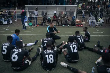 Ugo Kasuku (centre) organised the tournament and invited three European football scouts