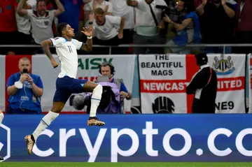 England's Marcus Rashford celebrates scoring against Wales
