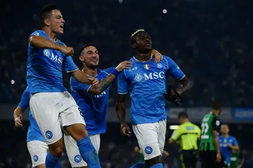 Osimhen (R) celebrates after scoring his third goal of the new season