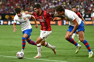 Christian Pulisic (C), pictured here pre-season, scored on his Serie A debut