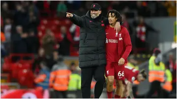 Klopp speaks with Trent Alexander-Arnold of Liverpool after their side's victory in the Premier League match between Liverpool FC and Wolves at Anfield. Photo by Stu Forster.