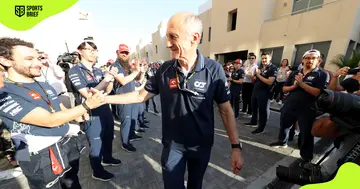 Franz Tost (l), is given a guard of honour