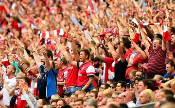 Arsenal fans sing during the FA Cup final match against Hull City at Wembley Stadium on May 17, 2014