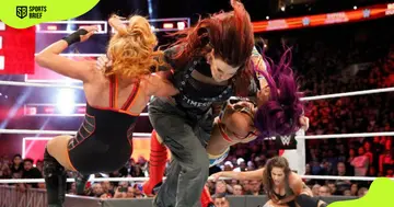 Lita (c) takes out Becky Lynch (l) and Sasha Banks (r).