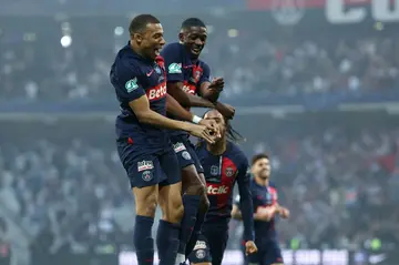Kylian Mbappe celebrates with Ousmane Dembele (C) after the latter put PSG ahead in Saturday's French Cup final