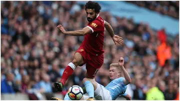 Mohamed Salah and Kevin De Bruyne in action during the Premier League match between Manchester City and Liverpool at the Etihad Stadium.