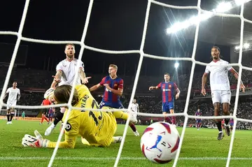 Former Real Madrid great Sergio Ramos (L) scored a painful own goal for Sevilla against Barcelona on Friday night in La Liga