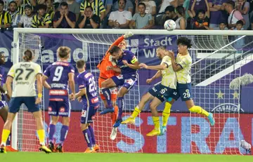 Close call: Austria Vienna goalkeeper Christian Fruechtl saves to deny a Fenerbahce attack in their Europa League clash