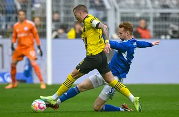 Marco Reus (in yellow) has been out of action since suffering an ankle injury against Schalke in mid-September