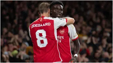 Bukayo Saka celebrates with Martin Odegaard during the UEFA Champions League match between Arsenal FC and PSV Eindhoven at Emirates Stadium. Photo by Visionhaus.