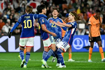 Japan's forward Riko Ueki celebrates after scoring a penalty