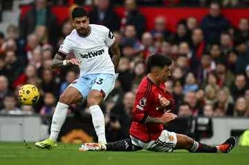 Lisandro Martinez (right) is set to be sidelined for at least eight weeks