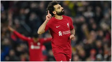 Mohamed Salah celebrates after scoring during the Premier League match between Liverpool FC and Manchester United at Anfield. Photo by Michael Regan.