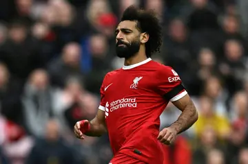 Mohamed Salah reacts after scoring his second goal for Liverpool in a Merseyside derby victory over Everton